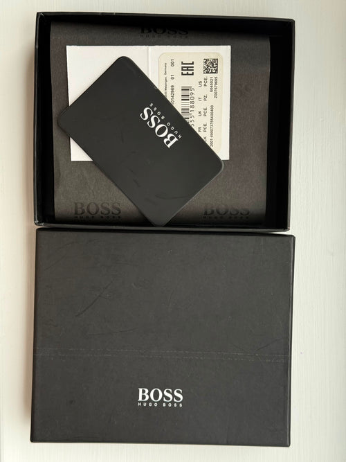 Black card with 'BOSS' branding inside an open black box on a light background